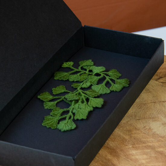 Maidenhair fern embroidered brooch close up in packaging box