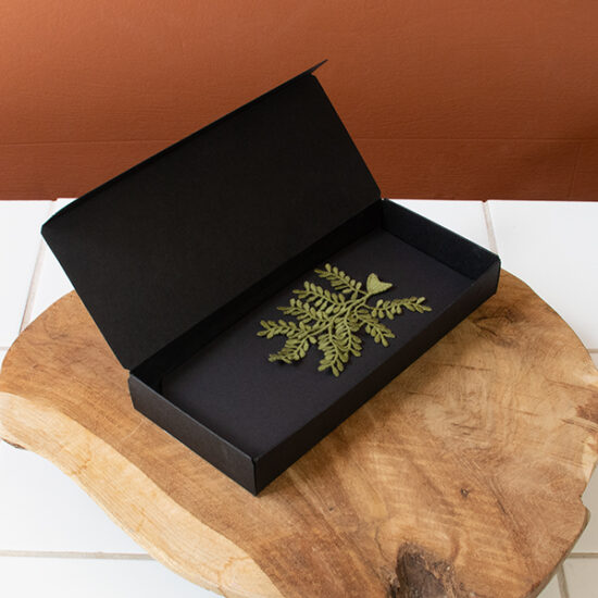 Olive branch embroidered brooch in packaging box